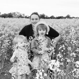 Kate Eats and her daughters exploring a canola field